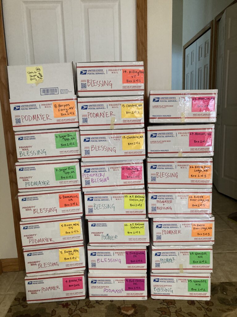 A stack of labeled resupply boxes for the Appalachian Trail