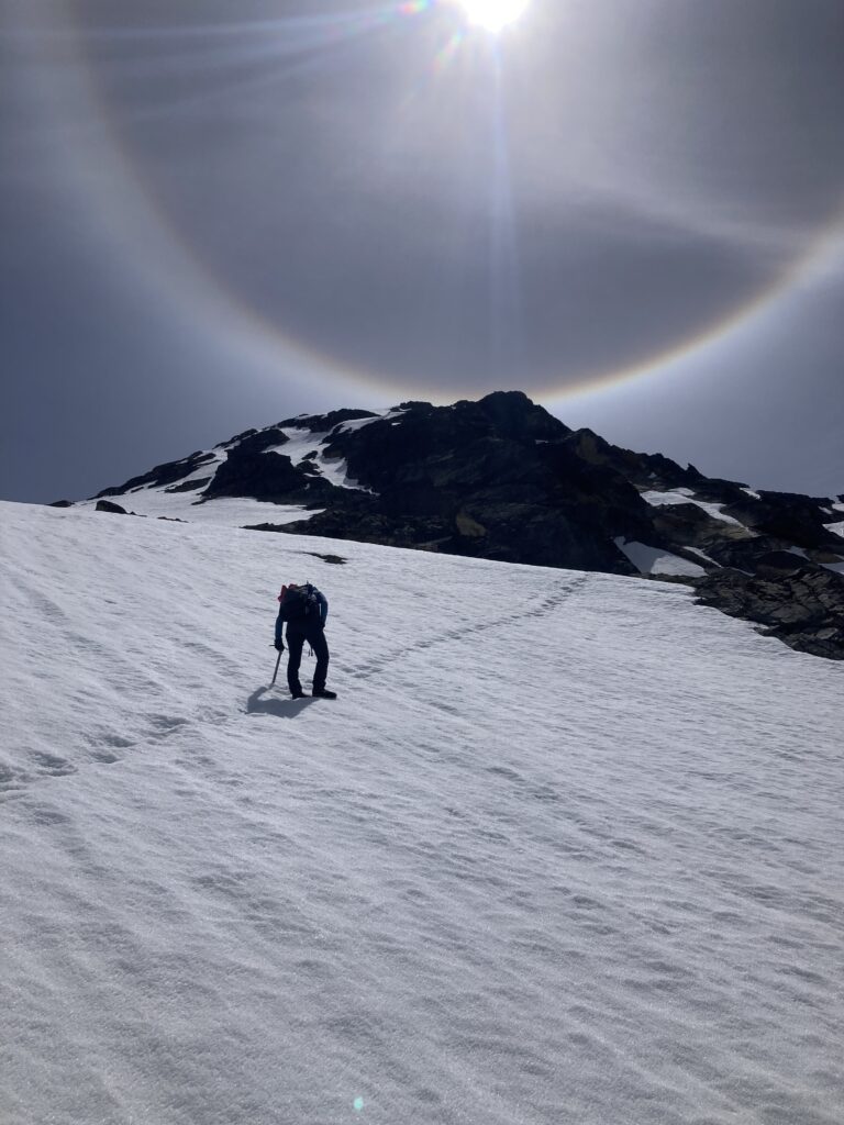 Carolyn cliimbing up snow towards Cardinal Peak in the Entiat Wilderness