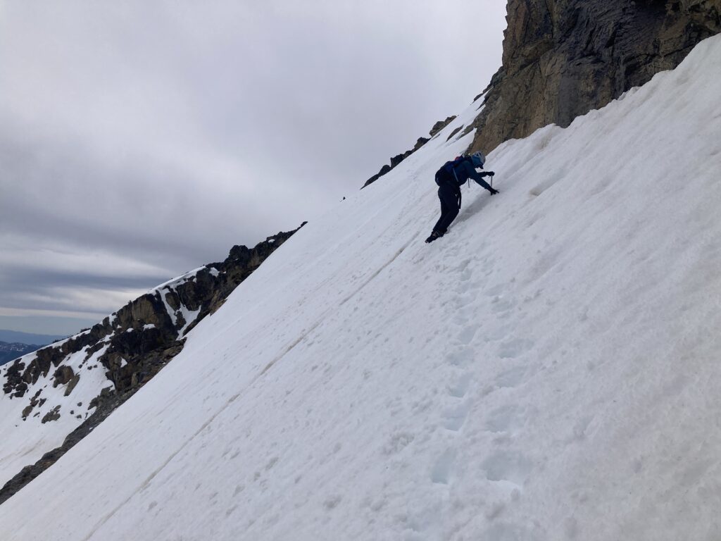 Carolyn climbing on steep snow while on Cardinal Peak in the Entiat Wilderness