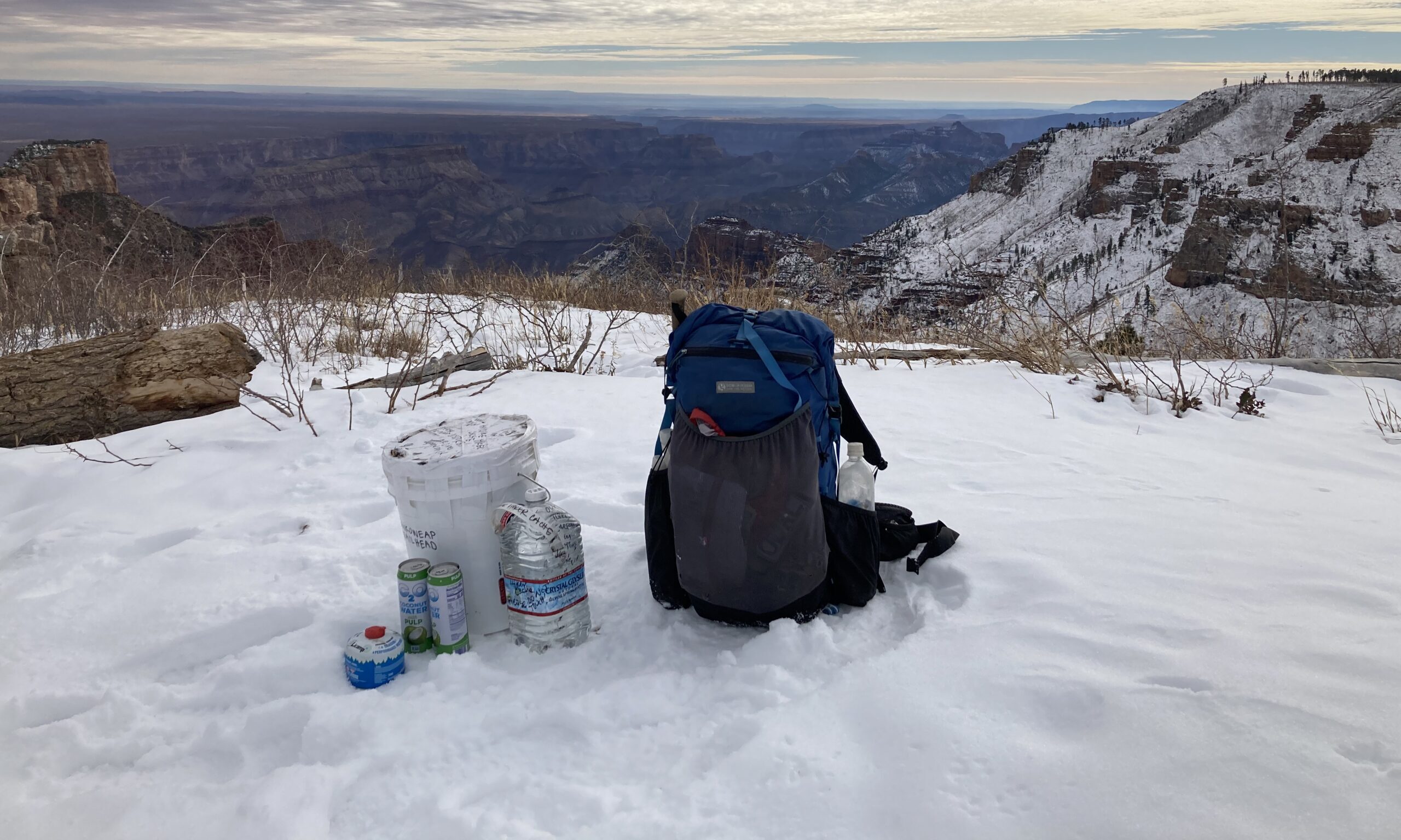A resupply bucket at Nankoweap Trailhead along the Hayduke Trail