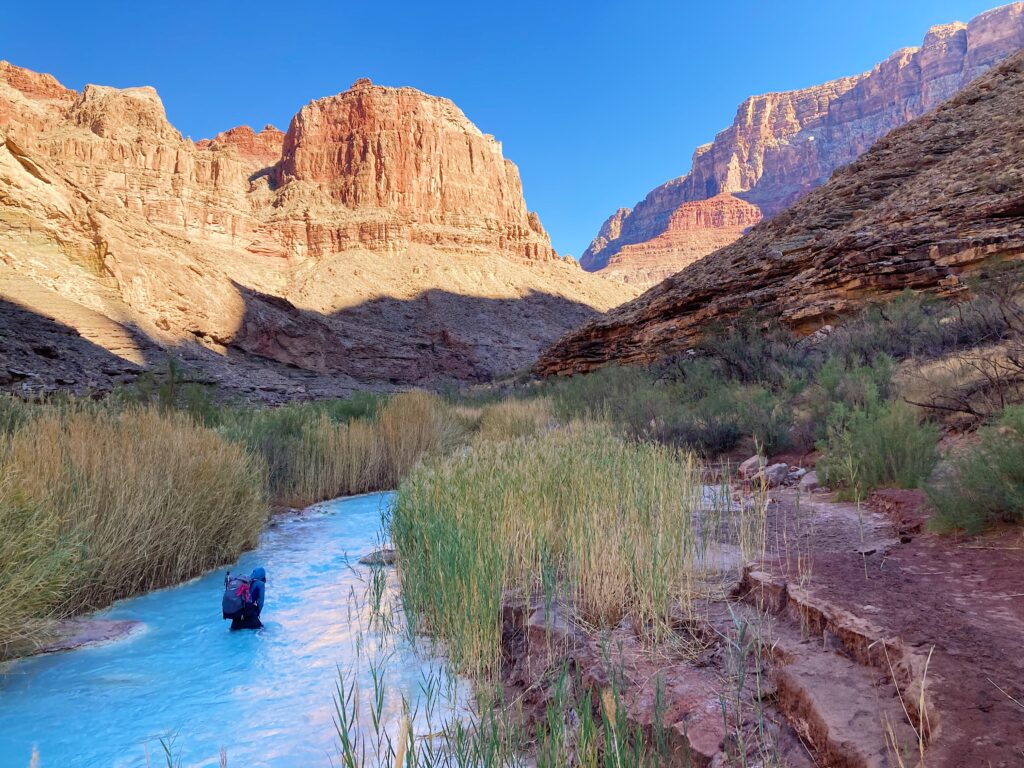 Crossing the Little Colorado River's aqu blue water