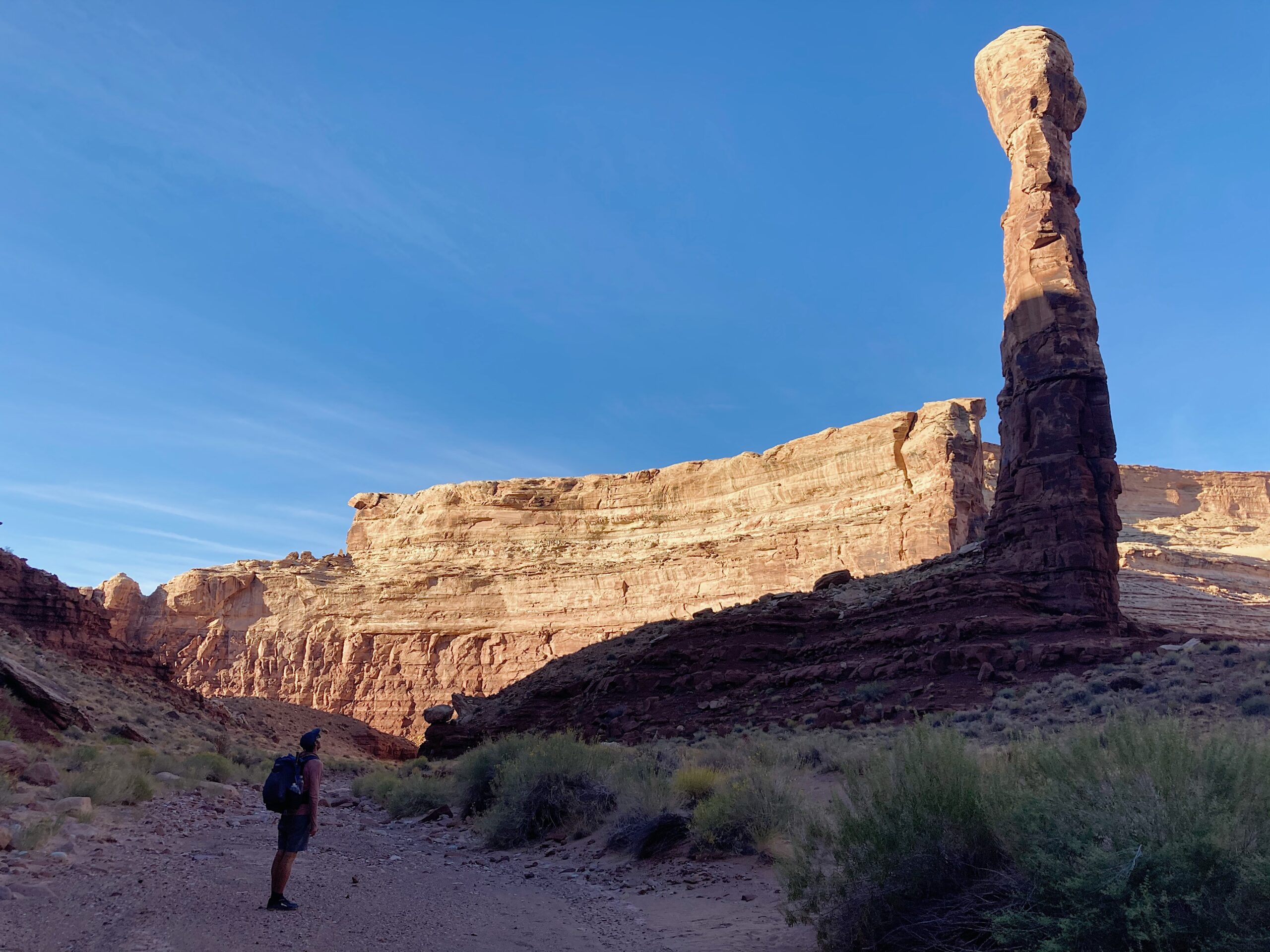 Jeff looking up at a huge rock tower on the Hayduke Trail