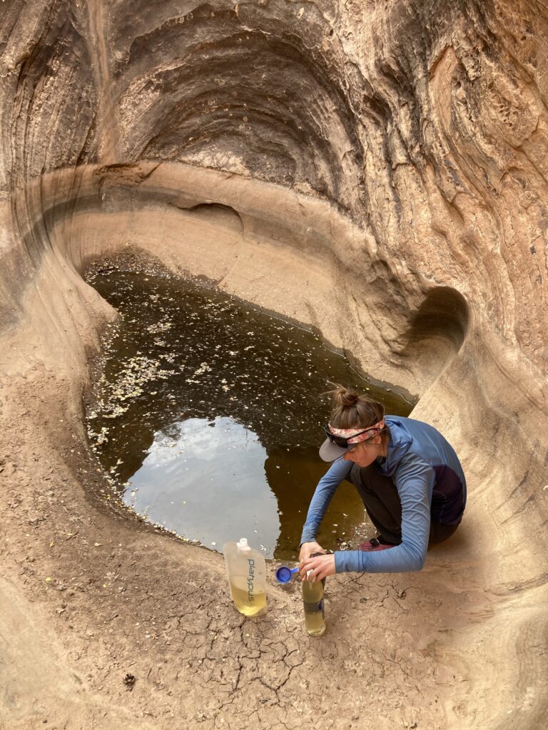 Murky green water source on the Hayduke Trail showing limited water quality