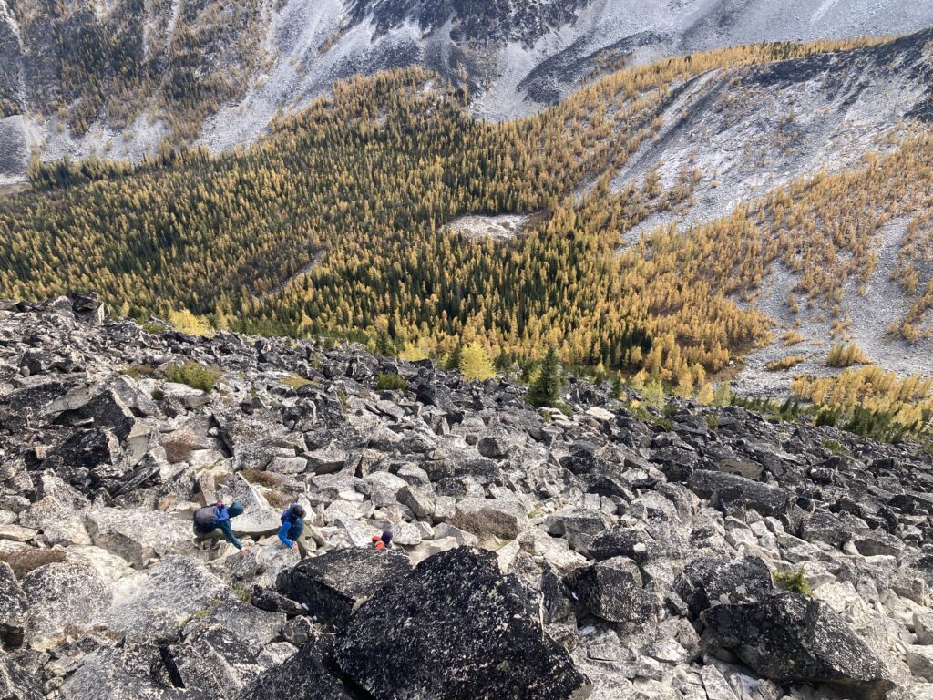 Hikers scrambling down from Hoodoo Peak in the Chelan-Sawtooth WIlderness of Washington State