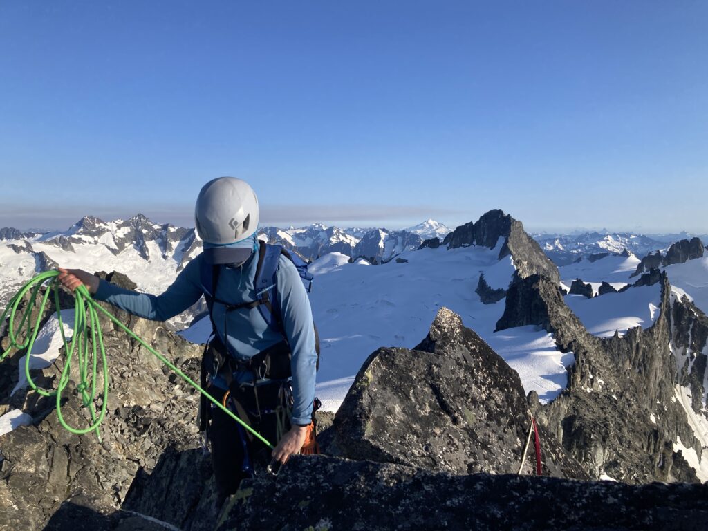 Carolyn setting up a rappel off of Austera Peak in the North Cascades along the Inspiration Traverse