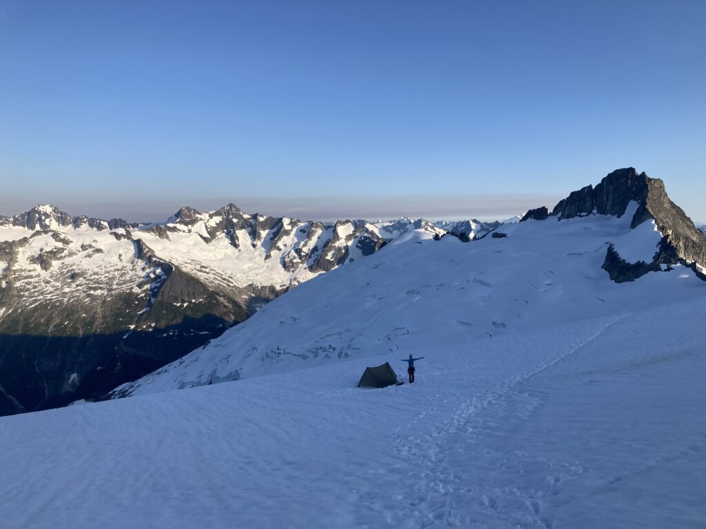 Carolyn posing in a magnificient glacial alpine setting in the North Cascades National Park along the Inspiration Traverse