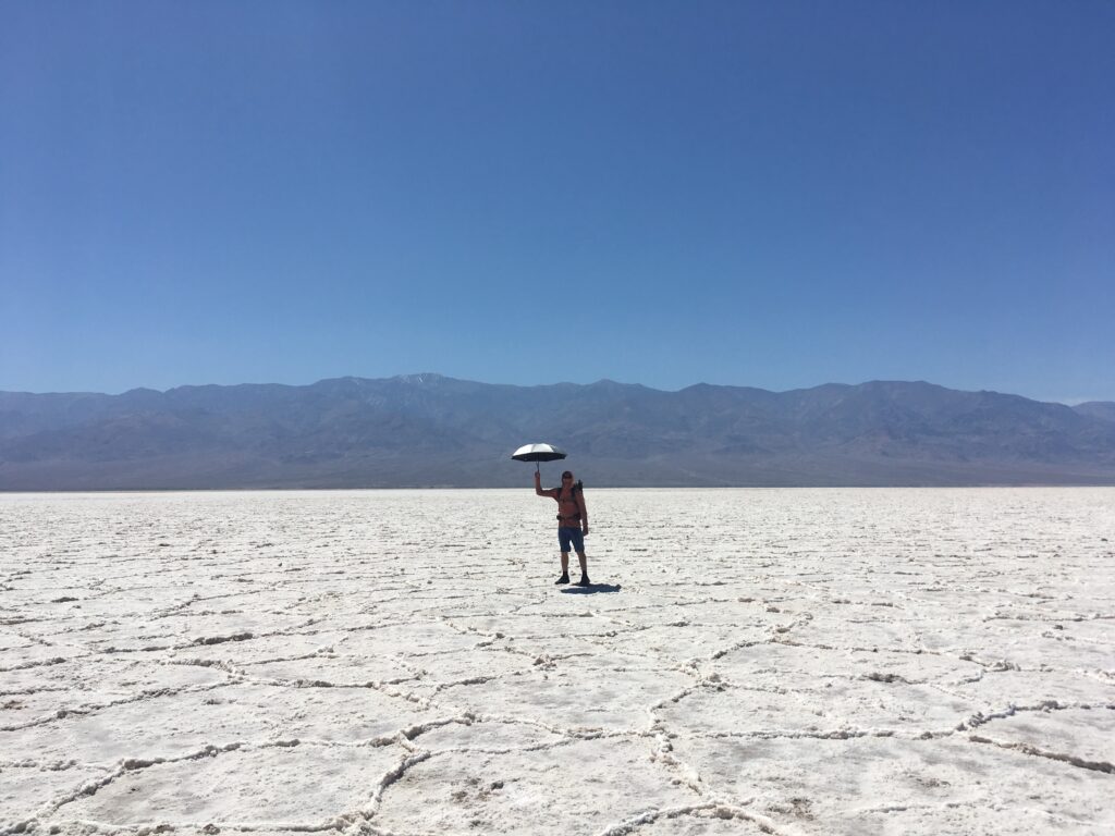 Jeff walking across the salt flats of Badwater Basin during the Lowest to Highest Route in Death Valley