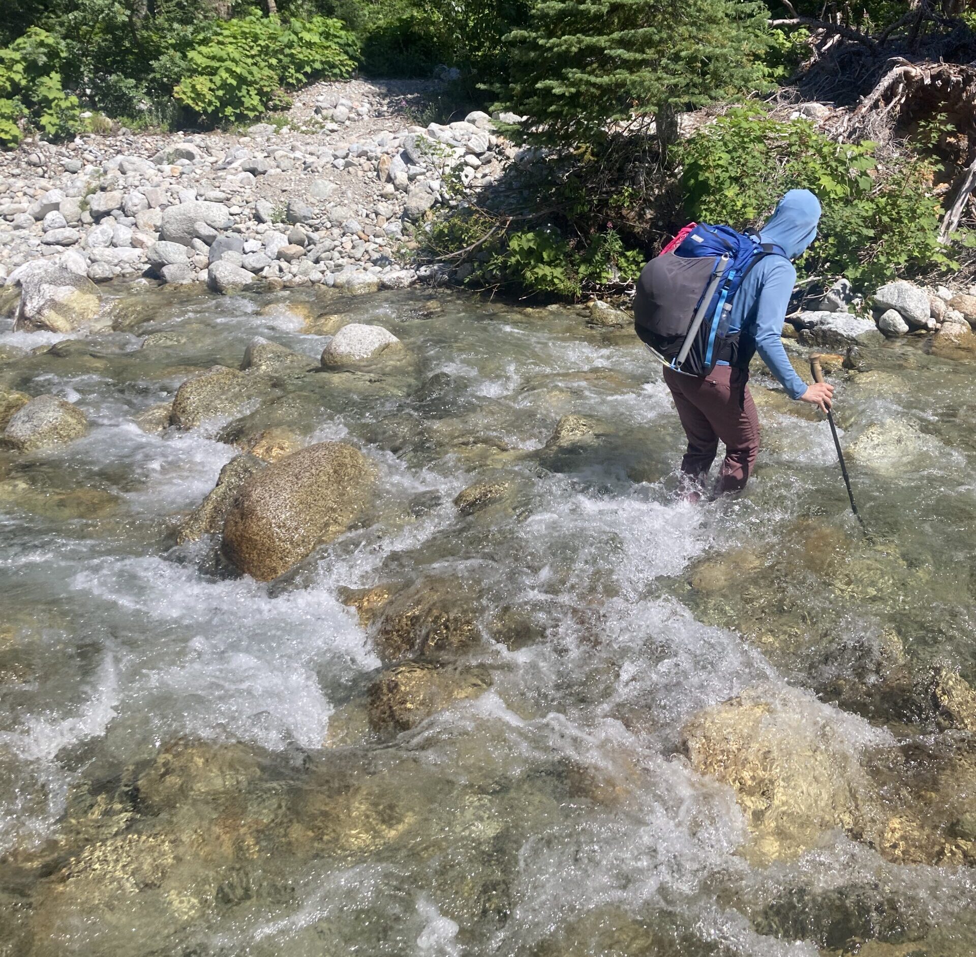 Carolyn crossing Grizzly Creek in the North Cascades National Park of Washington