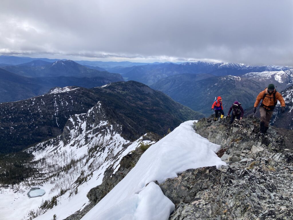 Climbers hike the easy ridgeline towards Robinson Mountain in the Pasayten Wilderness