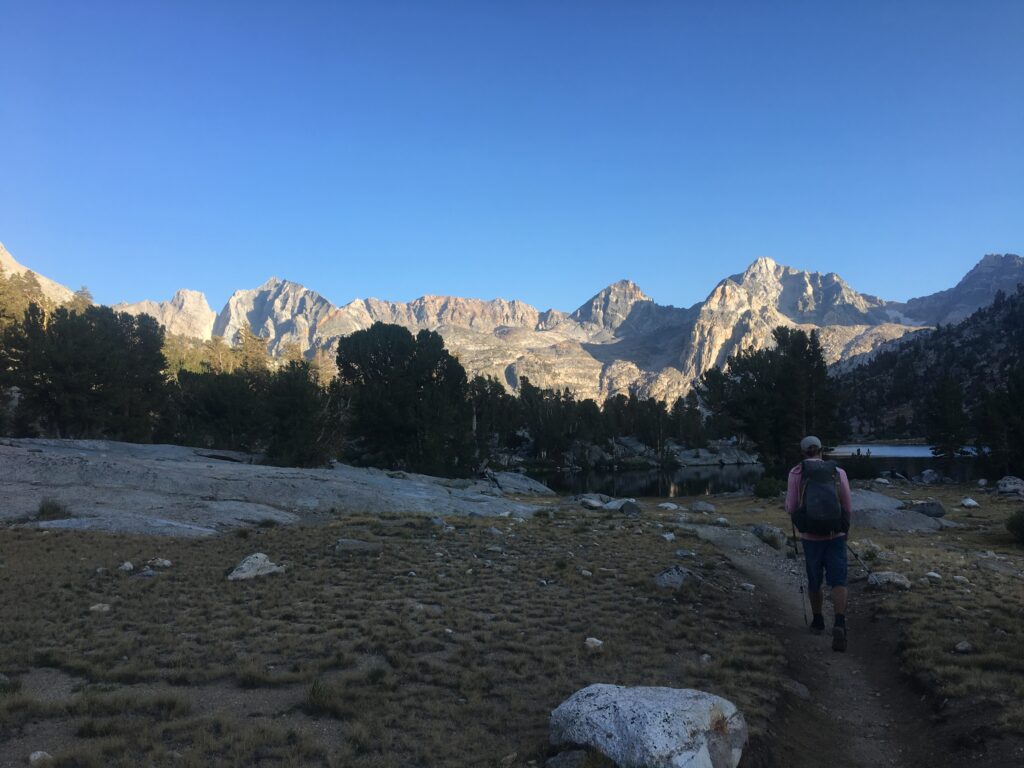 Jeff hiking through Rae Lakes Basin towards Glen Pass on the Southern Sierra High Route with the painted lady in the background