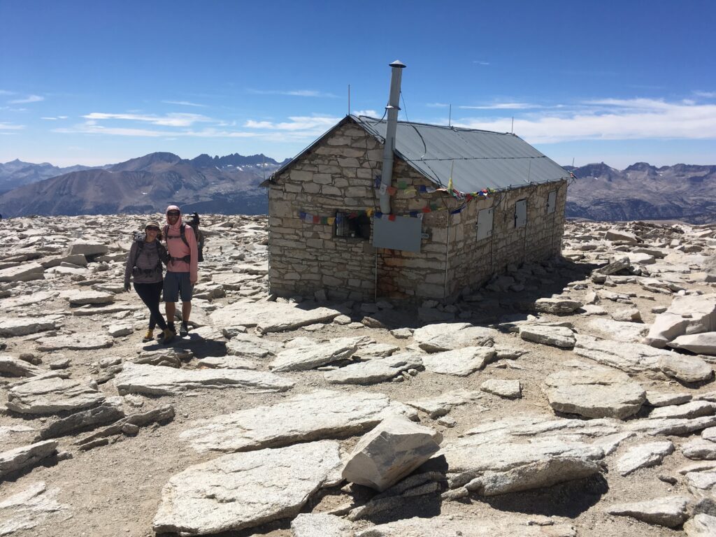Hiking over the summit of Mount Whitney in the Sierra Nevada