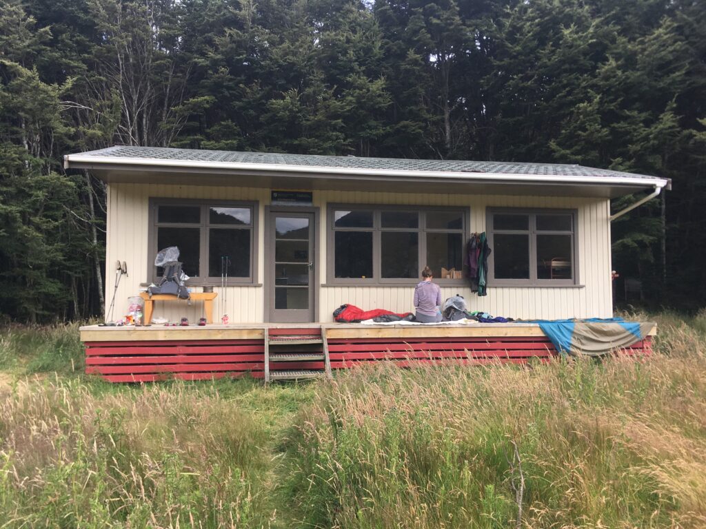 Carolyn taking a break at a Backcountry hut along the Te Araroa Trail