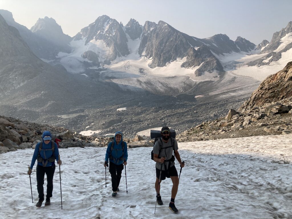 View of mountains behind backpackers in the Gannet area on the Wind River High Route