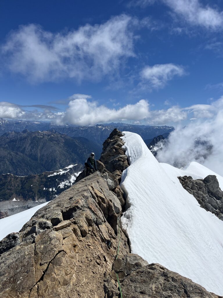 Carolyn on the final summit traverse of Dome Peak in the Glacier Peak Wilderness