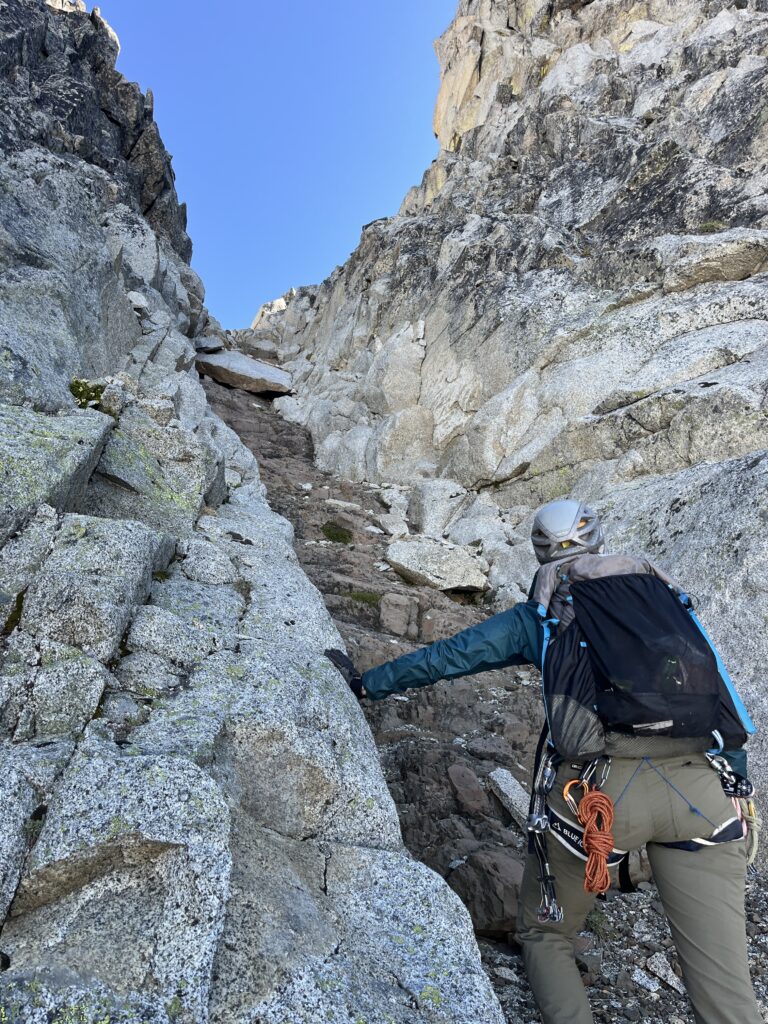 Carolyn scrambling up the gully towards Gunsight Peak in the Glacier Peak Wilderness