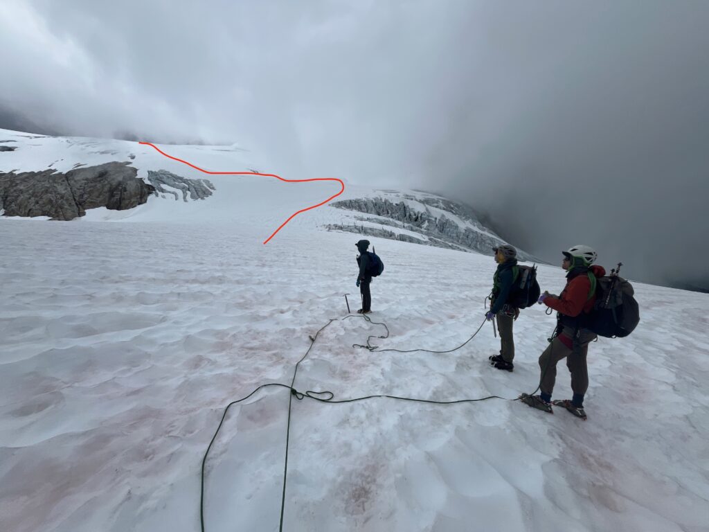 Climbers roped up to travel across the Neve Glacier in the North Cascades along the Isolation Traverse