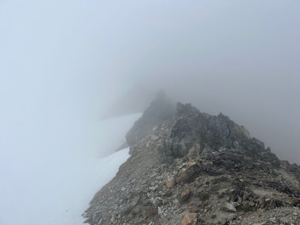 Cloudy ridgeline up to Snowfield Peak along the Isolation Traverse
