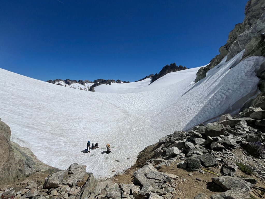 Climbers roping up on the McAllister Glacier along the Isolation Traverse in the North Cascades