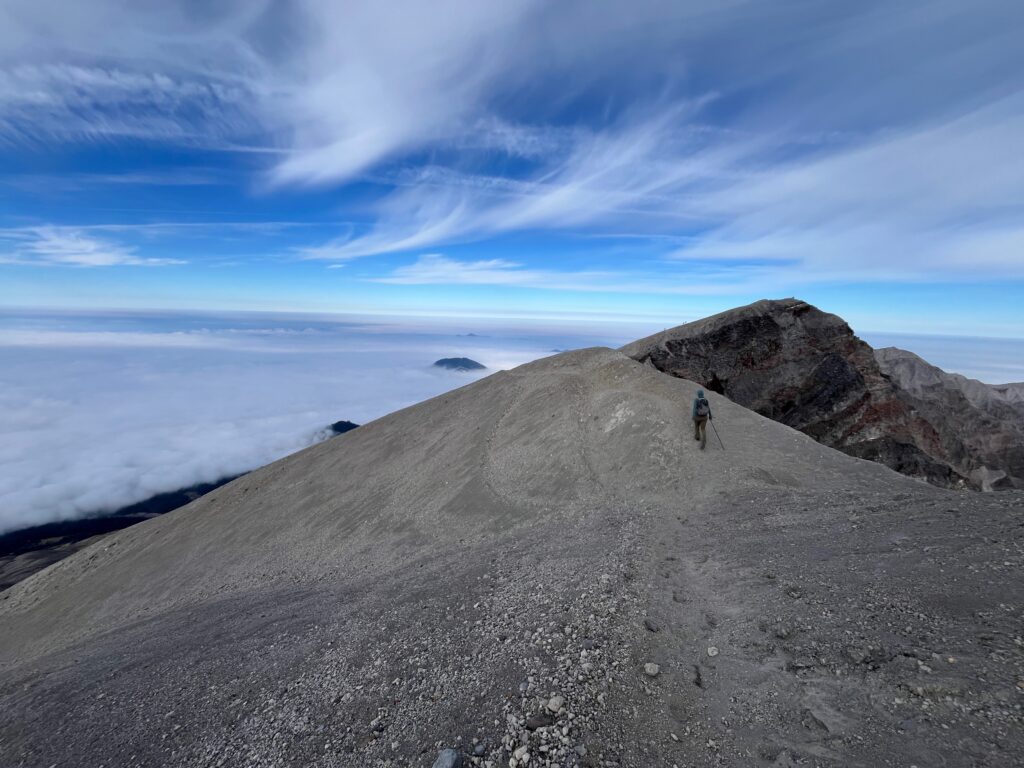 Carolyn hiking on the Upper ridgeline on Mount St. Helens Monitor Ridge Route