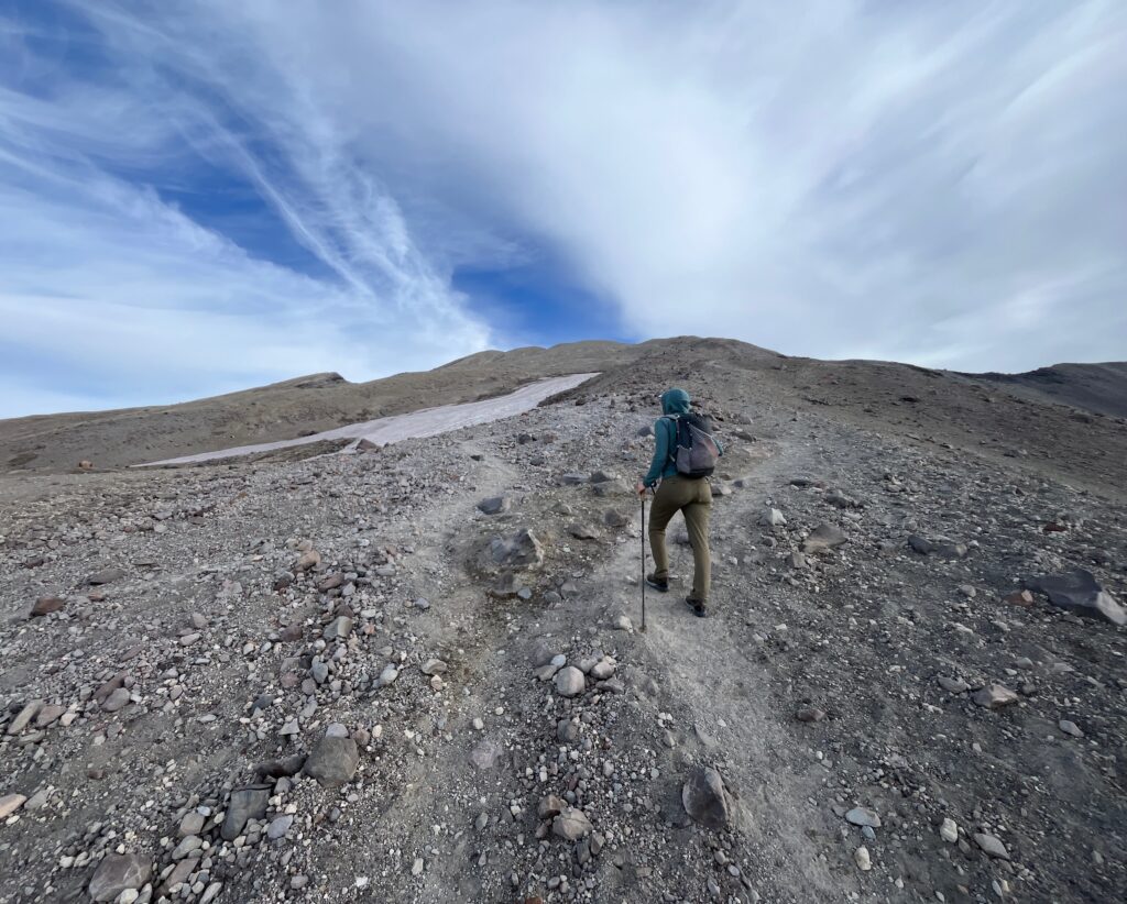 Carolyn hiking up the steep sandy trail on Mount St. Helens