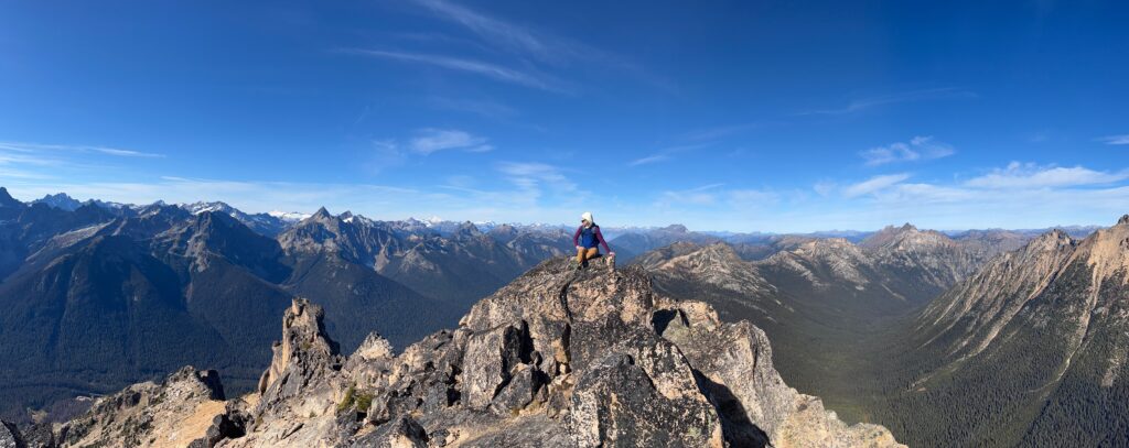 Carolyn sitting on the summit of Mount Hardy in the North Cascades of Washington State